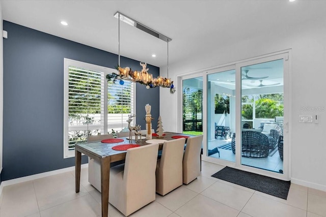 dining room featuring an inviting chandelier and light tile patterned flooring