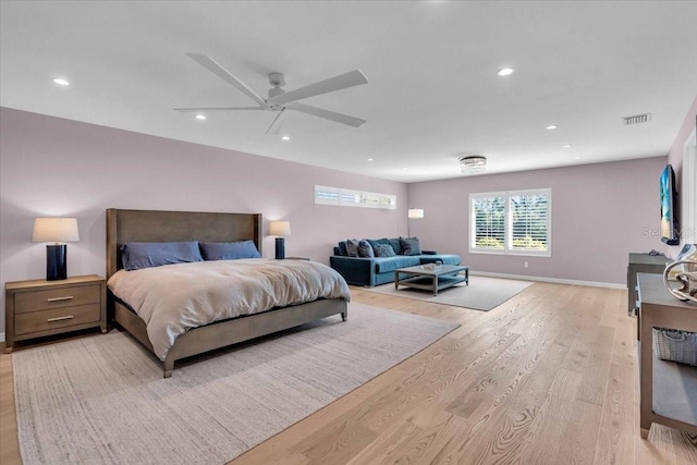 bedroom featuring light hardwood / wood-style floors and ceiling fan