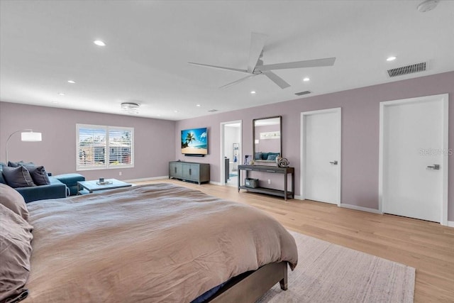 bedroom with ceiling fan and light wood-type flooring