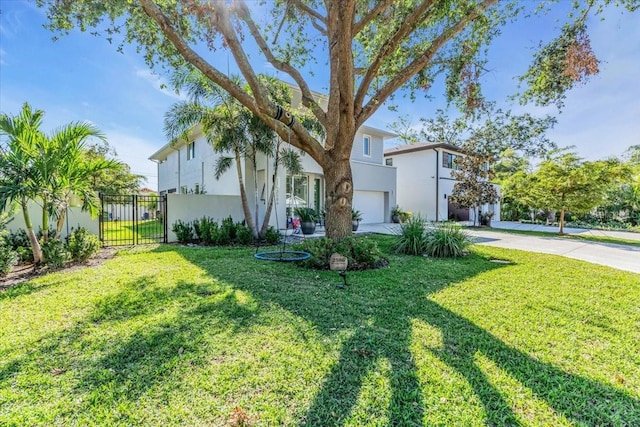 view of front of home featuring a front yard and a garage