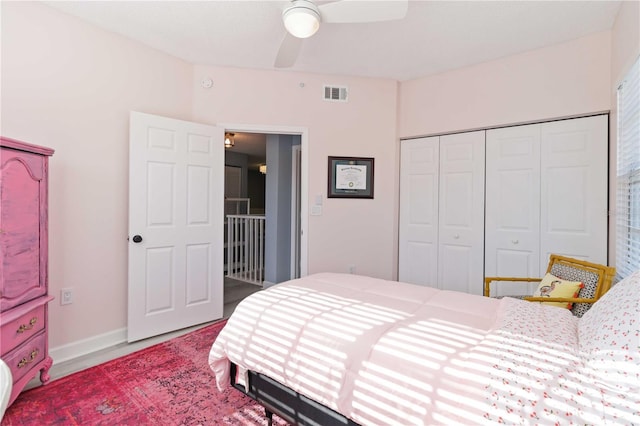 bedroom featuring ceiling fan and a closet