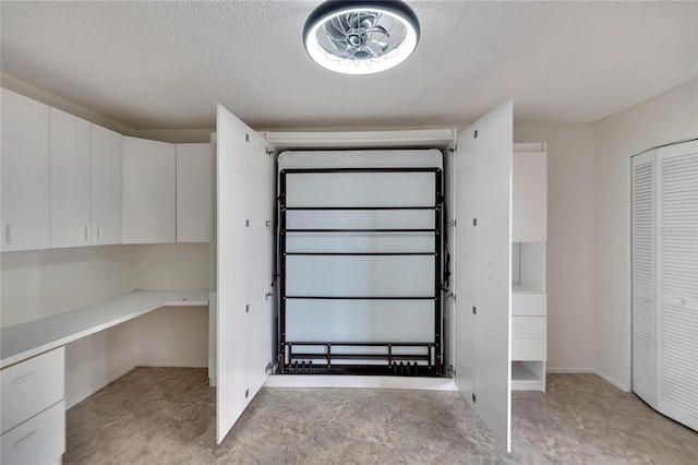 interior space with a textured ceiling