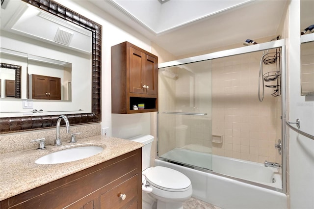 full bathroom featuring vanity, toilet, and enclosed tub / shower combo