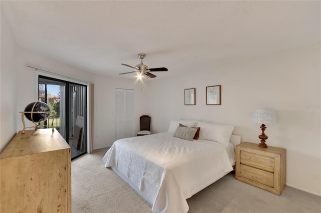 bedroom with access to exterior, a closet, light colored carpet, and ceiling fan