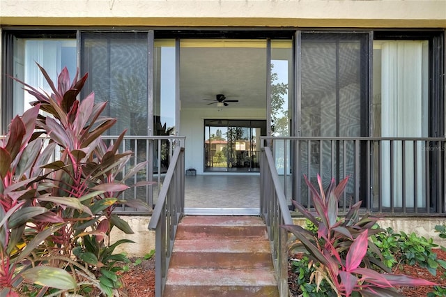 property entrance featuring ceiling fan