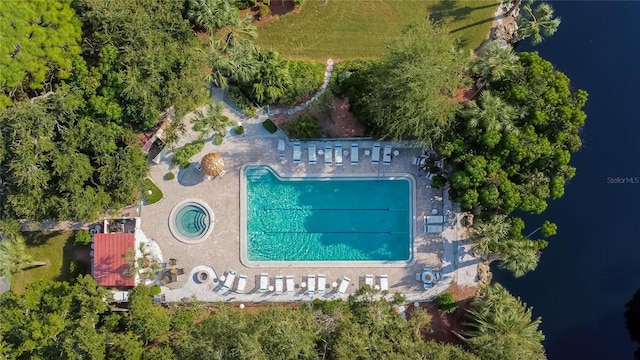 birds eye view of property with a water view