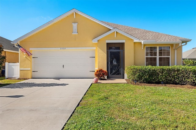 ranch-style house featuring a front yard and a garage