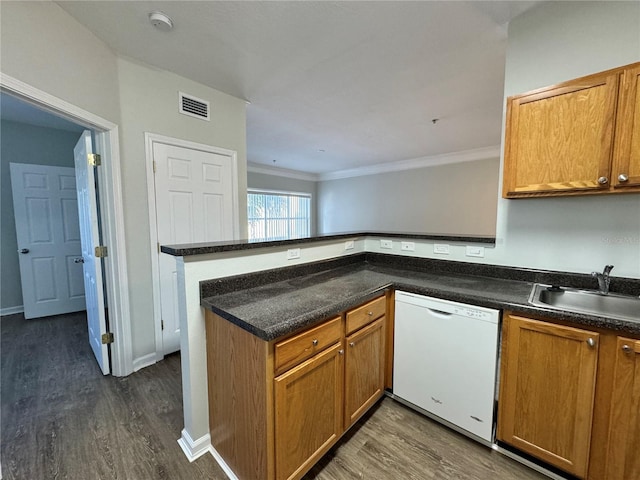 kitchen with sink, dark hardwood / wood-style floors, kitchen peninsula, crown molding, and white dishwasher