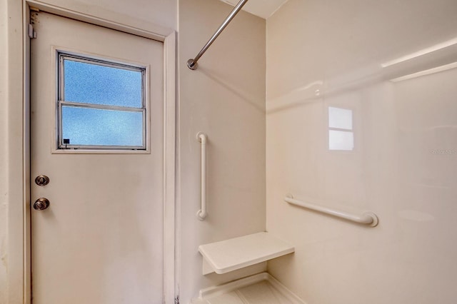 bathroom featuring walk in shower