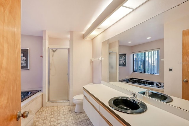 full bathroom featuring vanity, toilet, and plus walk in shower