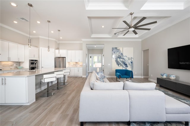 living room with ceiling fan, light hardwood / wood-style flooring, and ornamental molding