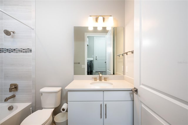 full bathroom with vanity, tiled shower / bath combo, and toilet