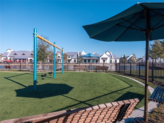 exterior space featuring a playground and a lawn