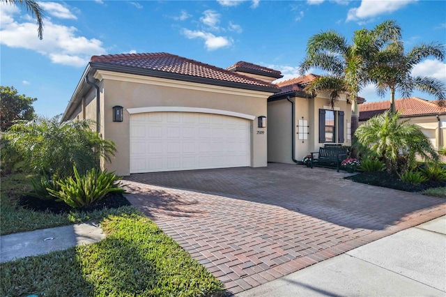 mediterranean / spanish-style house featuring a garage