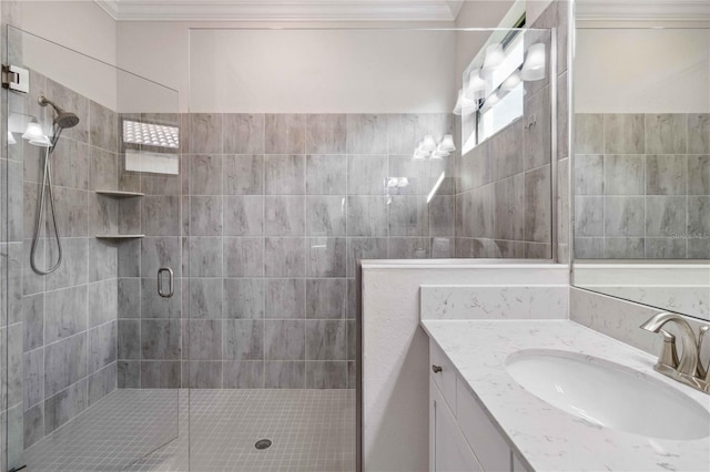 bathroom featuring crown molding, vanity, and an enclosed shower