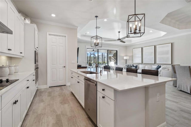 kitchen featuring light stone counters, a kitchen island with sink, dishwasher, white cabinets, and hanging light fixtures