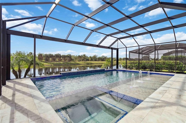 view of swimming pool with pool water feature, a water view, glass enclosure, and a patio area