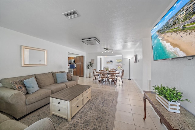 living room with light tile patterned floors