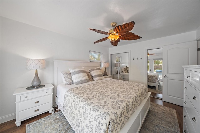 bedroom with ceiling fan and dark wood-type flooring