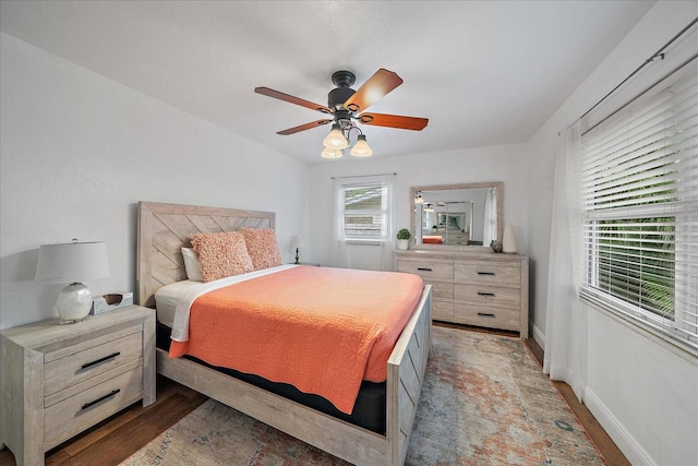 bedroom with hardwood / wood-style floors and ceiling fan