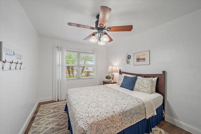 bedroom featuring hardwood / wood-style flooring and ceiling fan