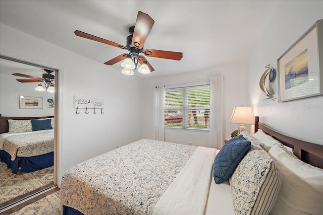 bedroom featuring hardwood / wood-style flooring and ceiling fan