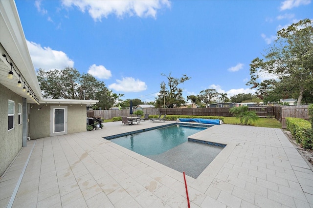 view of pool with a patio area