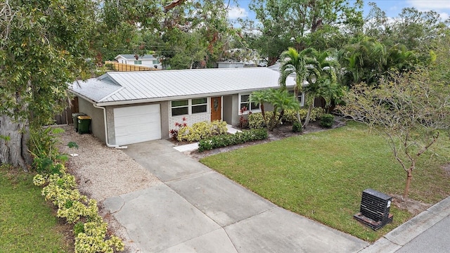 ranch-style house with a front yard and a garage