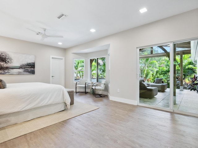 bedroom featuring access to exterior, ceiling fan, and hardwood / wood-style flooring