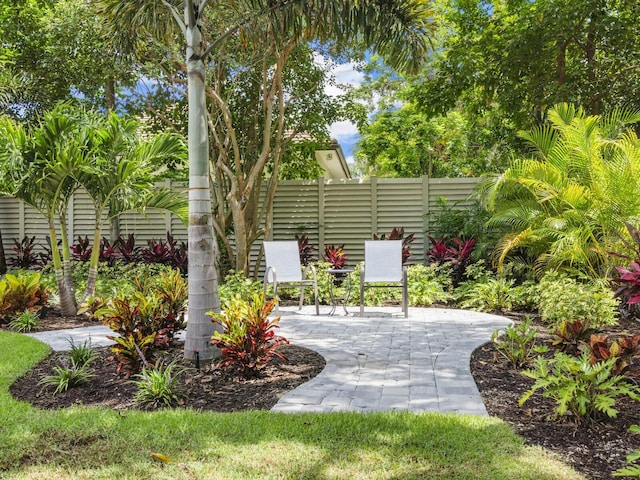 view of property's community with a patio area