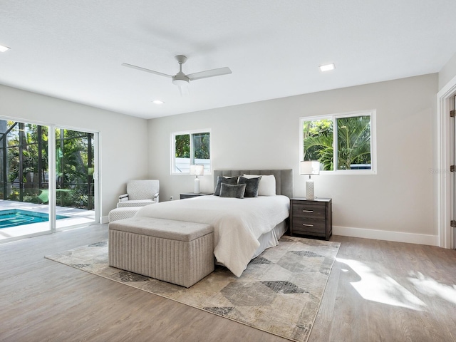 bedroom with access to outside, multiple windows, and ceiling fan