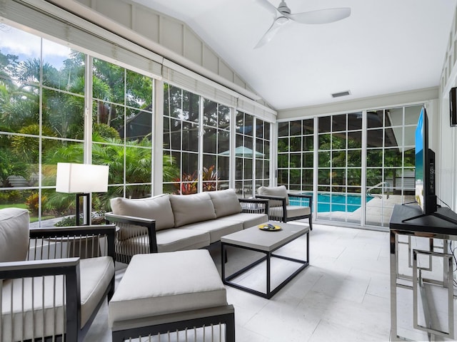 sunroom / solarium featuring ceiling fan and lofted ceiling