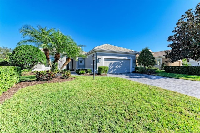 single story home featuring a front yard and a garage