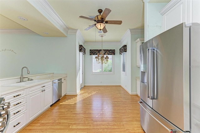 kitchen with white cabinetry, sink, stainless steel appliances, and light wood-type flooring