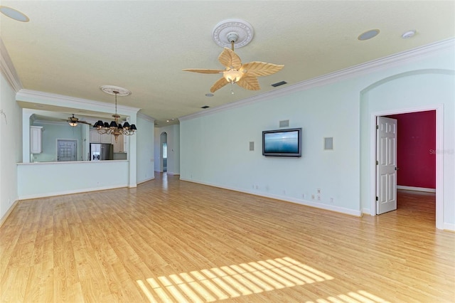 unfurnished living room with light hardwood / wood-style flooring, a chandelier, a textured ceiling, and ornamental molding