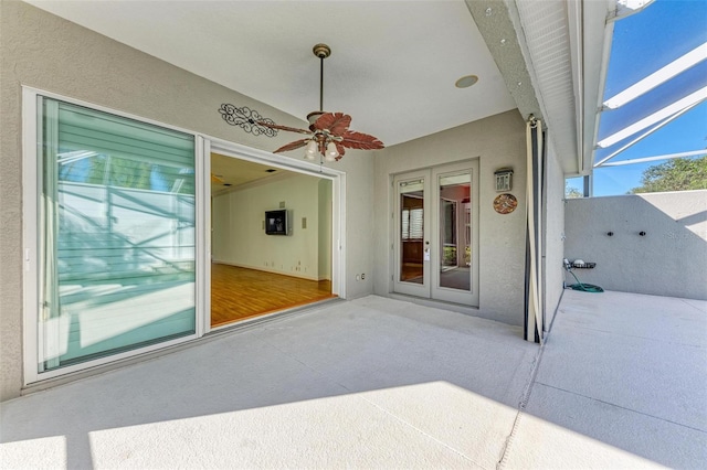 view of patio with ceiling fan and french doors