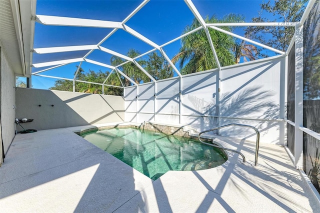 view of pool featuring a lanai and a patio area