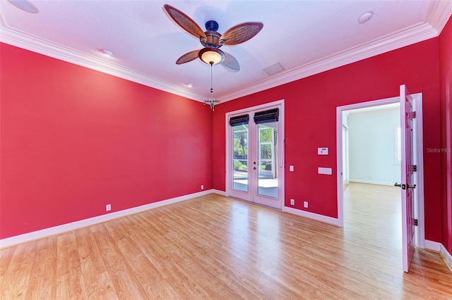 empty room featuring ceiling fan, crown molding, wood-type flooring, and a textured ceiling