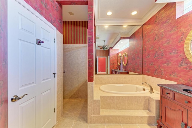 bathroom featuring tile patterned flooring, vanity, a relaxing tiled tub, and crown molding