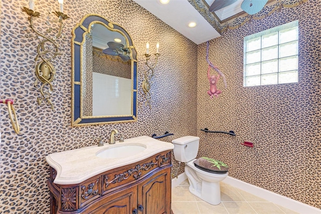 bathroom with tile patterned floors, vanity, and toilet