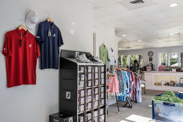 walk in closet with a drop ceiling