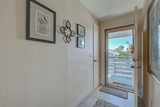 entryway with light tile patterned floors