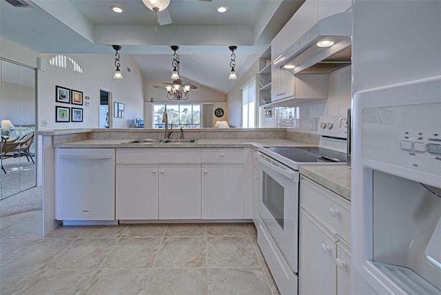 kitchen with white appliances, vaulted ceiling, decorative light fixtures, white cabinetry, and range hood