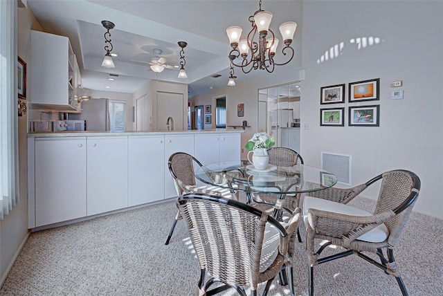 dining room with a notable chandelier and sink