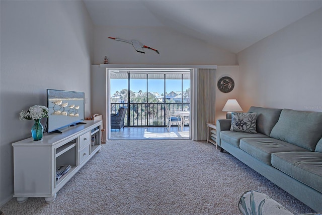 living room featuring carpet flooring and lofted ceiling