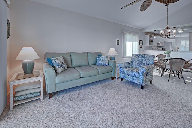 living room featuring light colored carpet, a wealth of natural light, and lofted ceiling