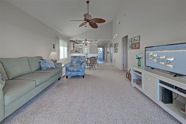 carpeted living room with ceiling fan and high vaulted ceiling