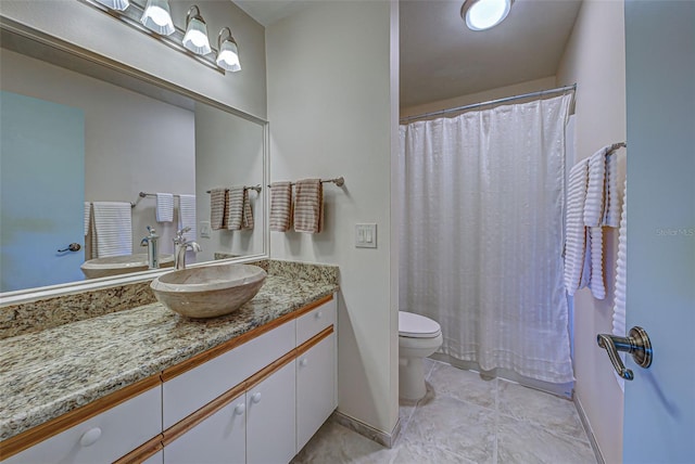 bathroom with vanity, a shower with shower curtain, and toilet