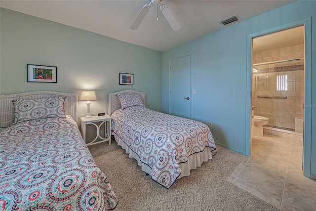 bedroom featuring carpet flooring, ceiling fan, and ensuite bath