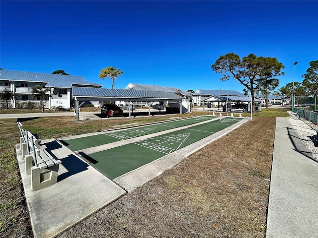 view of home's community featuring a lawn